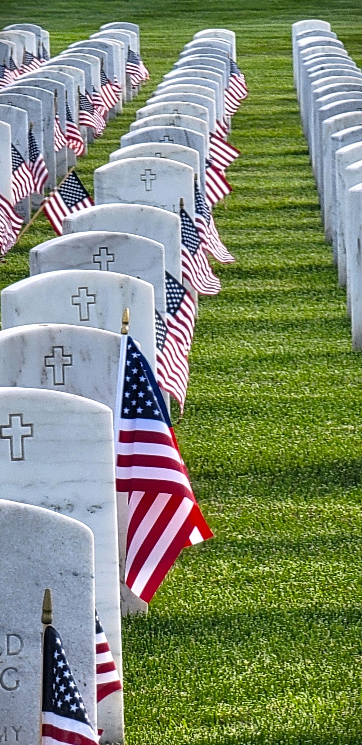 American flags placed at headstones for Memorial Day at Great Lakes National Cemetery